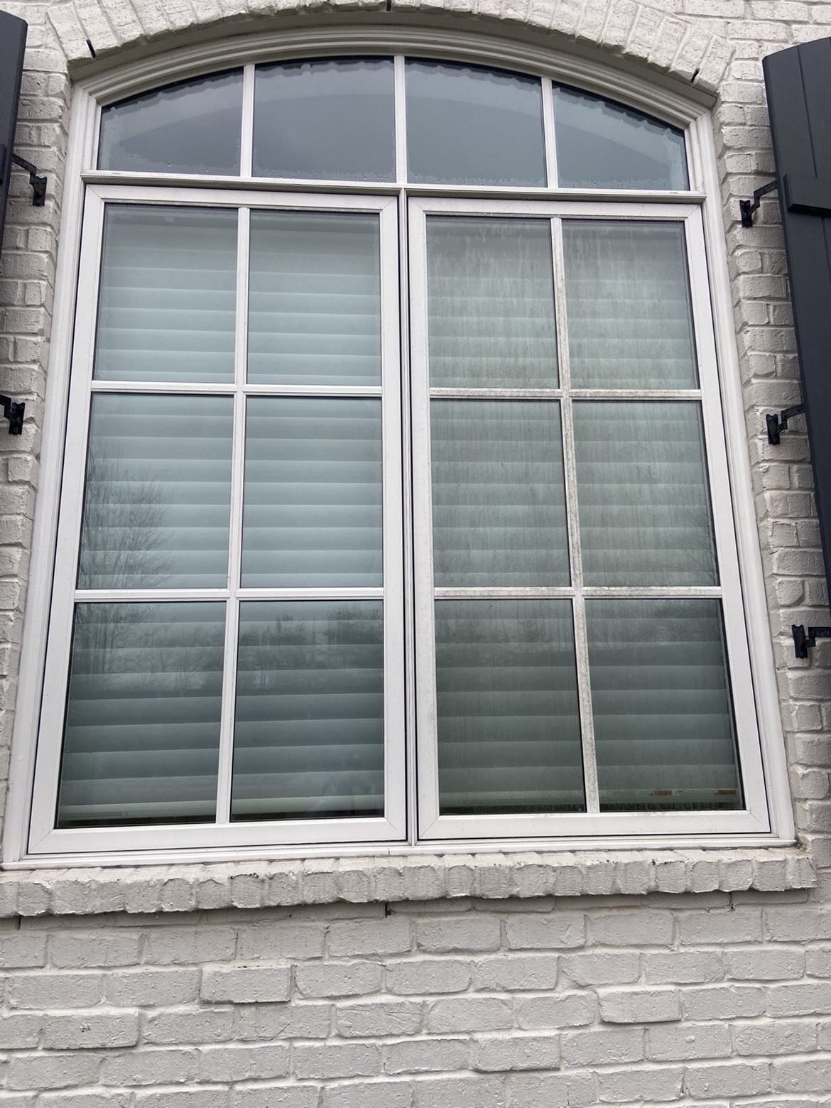 Arched window after professional cleaning